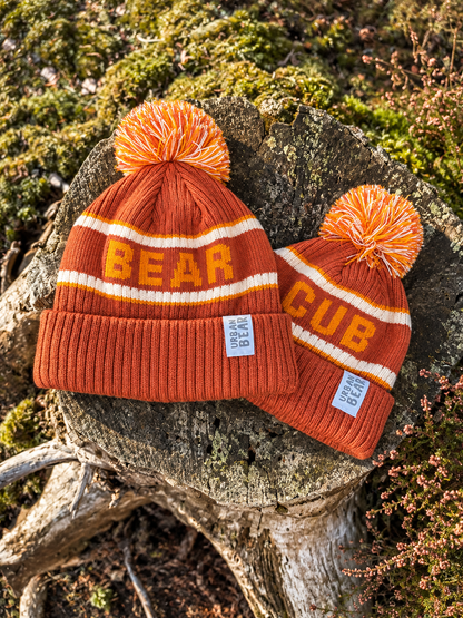 Bear adult hat and cub child hat in rust orange with a mustard yellow stripe