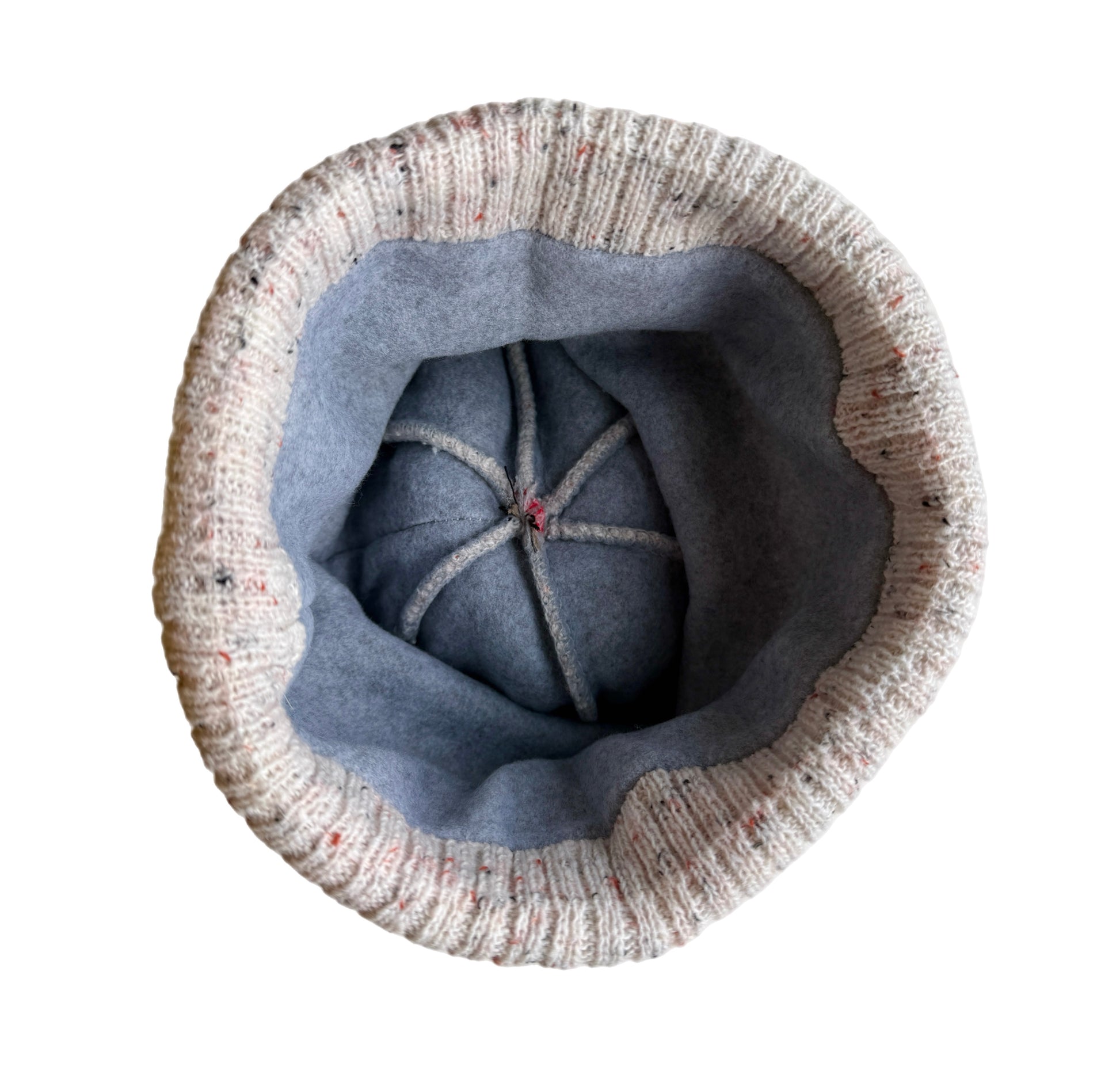 Inside of bobble hat, showing fleece lining.