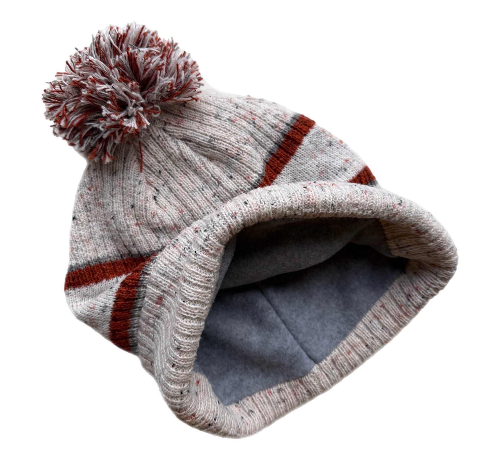 Knitted beanie with a pom-pom on a white background