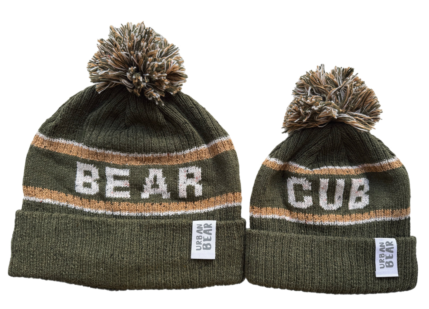 Adult and child green beanies with pom-poms, one labeled 'Bear' and the other 'Cub', on a white background.