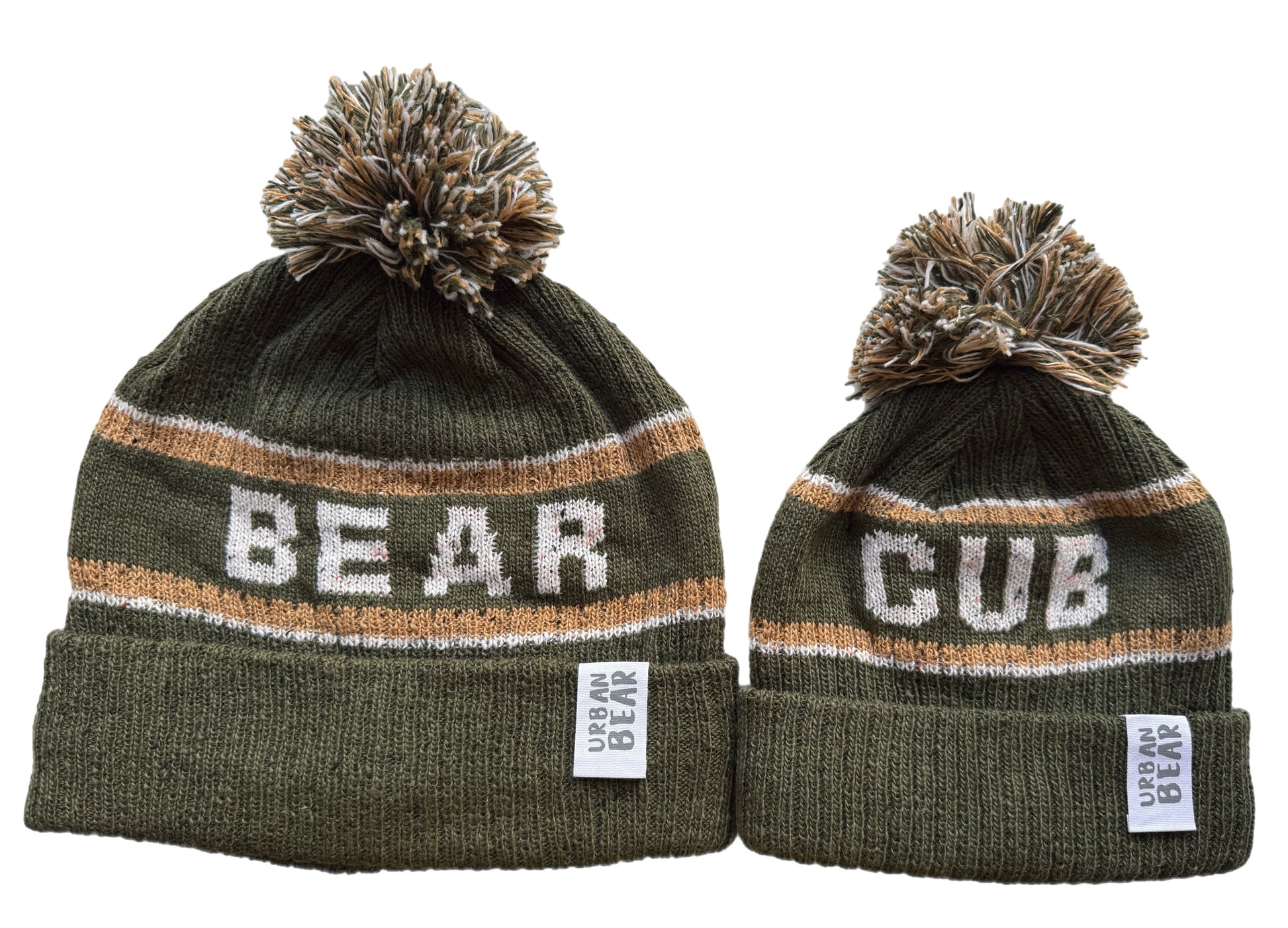 Adult and child green beanies with pom-poms, one labeled 'Bear' and the other 'Cub', on a white background.